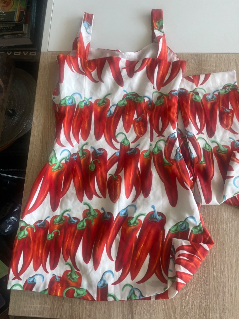 Red chili pepper print ruched mini dress featuring a side bow accent - Picture 10 of 10